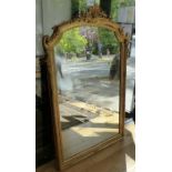 A LARGE DECORATIVE 19TH CENTURY FRENCH CARVED GILTWOOD FRAMED MIRROR .
