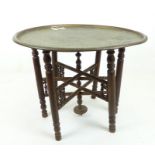 A Persian Top Table On bamboo Turned Legs.