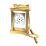 An Eight day Brass Cased Miniature Carriage Clock With Key.