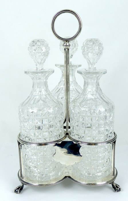 A Late Georgian Tantalus With Three Cut Crystal Decanters