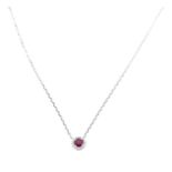 An 18 Carat White Gold Ruby And Diamond Pendant Necklace On Gold Chain.