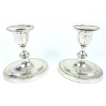 A Pair Of Sterling Silver Candlesticks