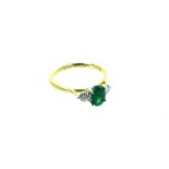 An 18 Carat Yellow Gold Emerald And Diamond Ring.