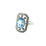 A Silver Art Deco Style Ring Set With Cubic Zirconia And Central Aquamarine Panel.