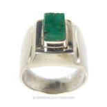 A Silver/White Metal Ring With A Square Cut Emerald