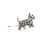 A Silver Scottie Dog Brooch With Ruby Eyes.