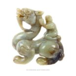 A Chinese Qing Dynasty Celadon Jade Dragon With Figure Riding