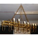 A LARGE 20TH CENTURY DESIGNER GILT BRASS TWELVE BRANCH CHANDELIER .