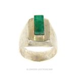 A Large Rectangle Cut Emerald In White Metal/Silver Ring.