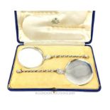 A Vintage Cased Pair of Solid Silver Flat Serving Spoons with Twisted Stems.