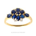 A Vintage 9 Carat Gold Ring Set With Deep Blue Sri Lankan Sapphires And Diamonds