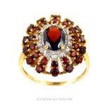 Vintage 9 Carat Gold Ring With Sunburst Setting Of Twenty Eight Garnets And 14 Round Cut Diamonds