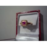 BAGUE EN OR 750 mm, sertie de brillants et quatre rubis. TD : 53. -