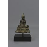 A Thai 18/19th century bronze Buddha fitted on a w