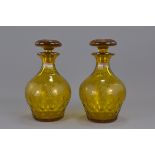 A pair of Amber colour pear shape glass stoppered