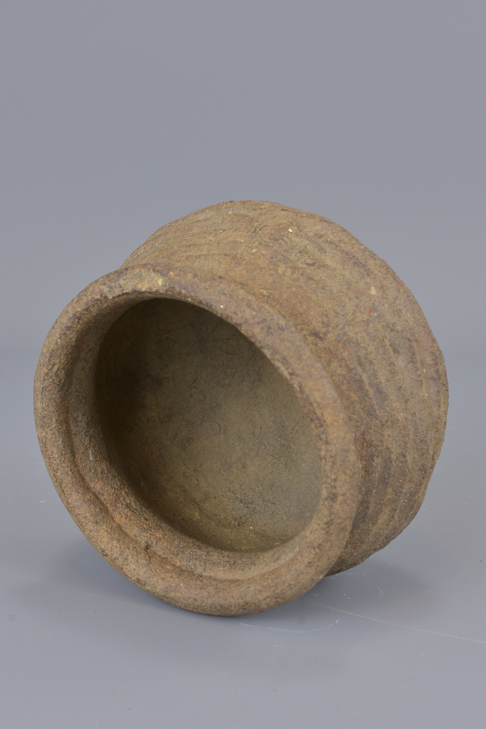 A stoneware Neolithic pot. 8cm tall - Image 5 of 5