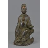 A large Chinese 17/18th century bronze seated figu