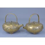 A pair of Chinese 18/19th century bronze tea pots