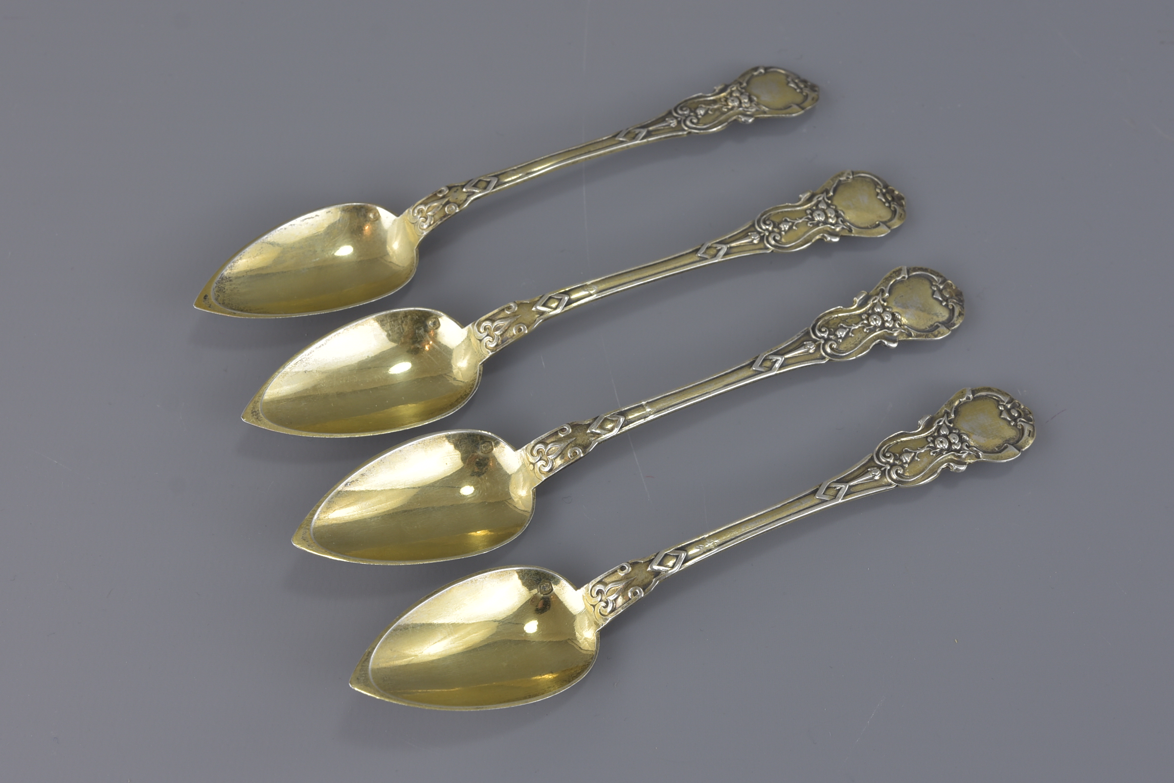 A set of four French silver gilt spoons 14.5cm len