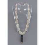 A rock crystal necklace with large roller seal sto