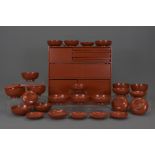 A Japanese lacquer picnic set in wooden carrying b