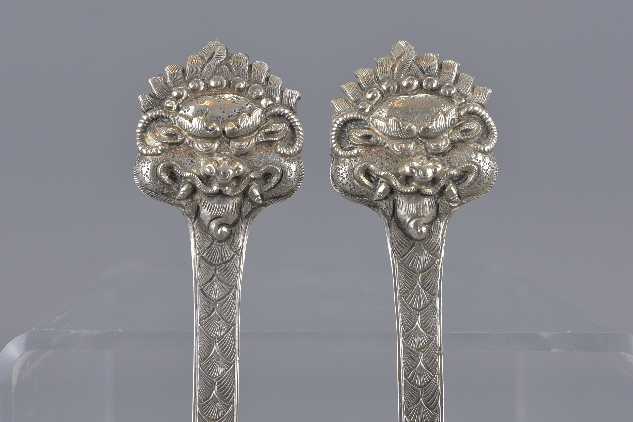 A pair of South East Asian mask head silver spoons - Image 3 of 3