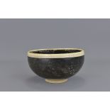 A Chinese Sung/Yuan Dynasty black-glazed bowlDing