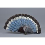 A Jay Bird feather and tortoise shell fan