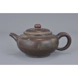 A Chinese Xiying teapot. 16 cm.