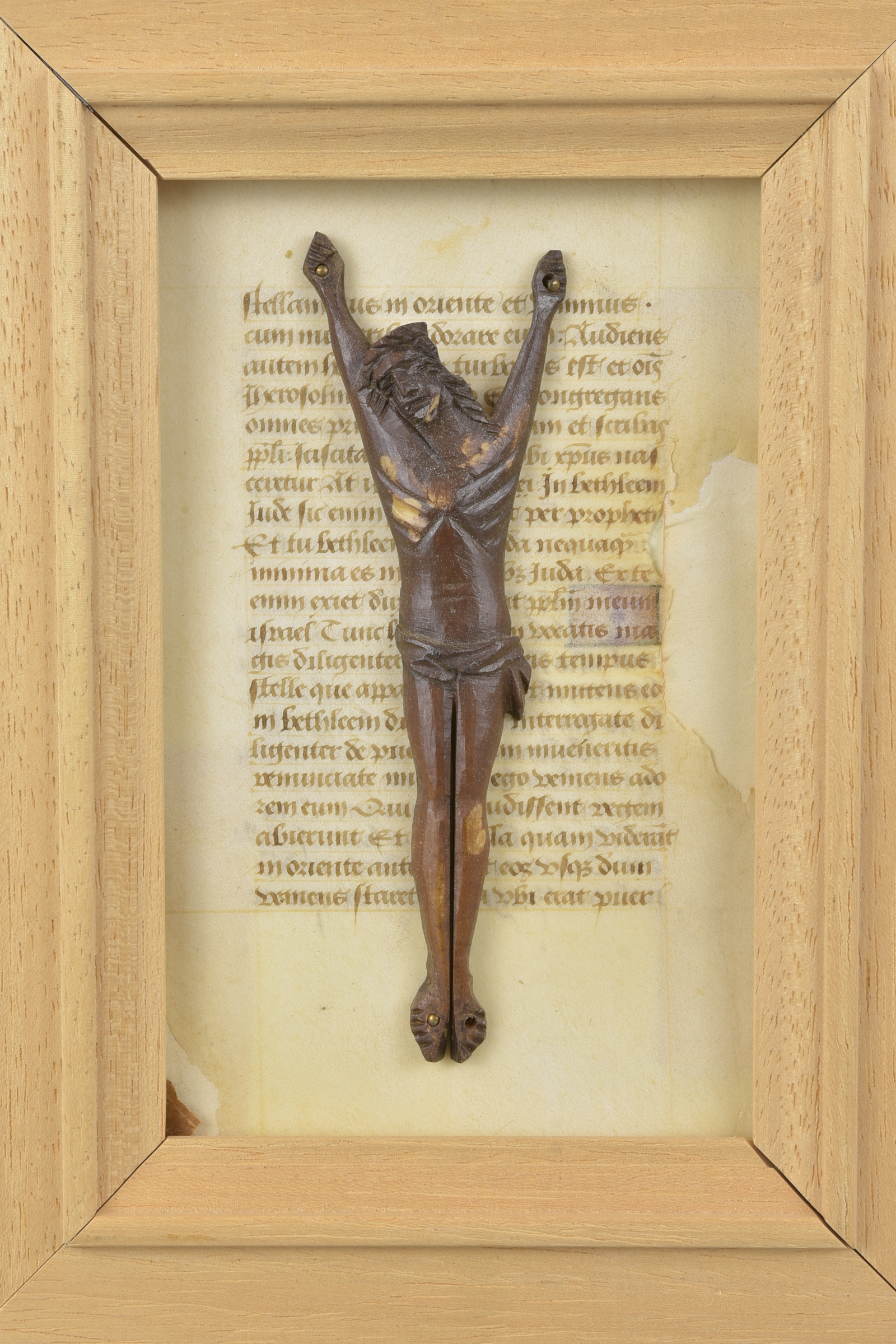 A bone crucifix carving on paper manuscript page. - Image 2 of 3