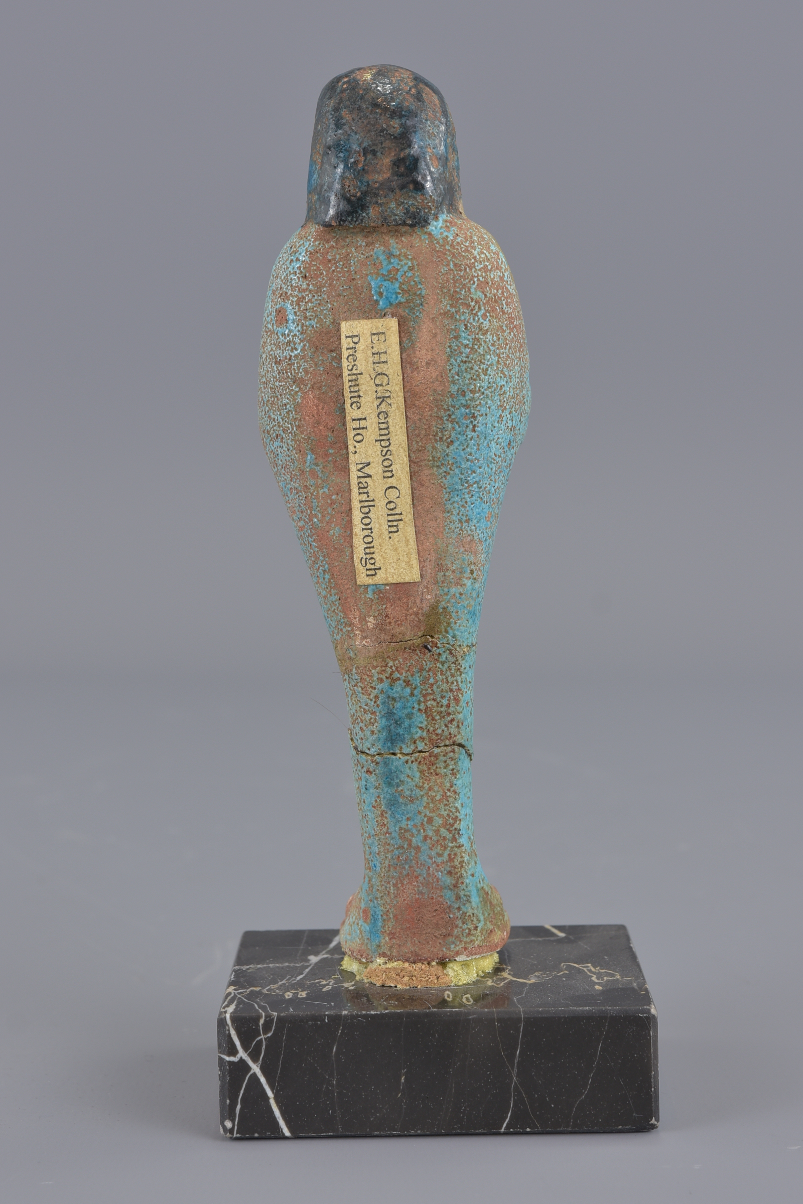 An Egyptian blue faience figure on marble stand. 1 - Image 3 of 4