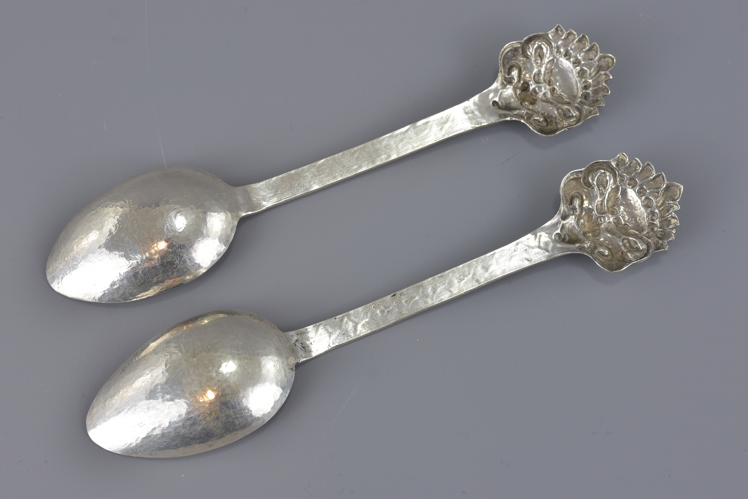 A pair of South East Asian mask head silver spoons - Image 2 of 3