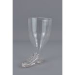 A mid 19th century glass stirrup cup in the form o