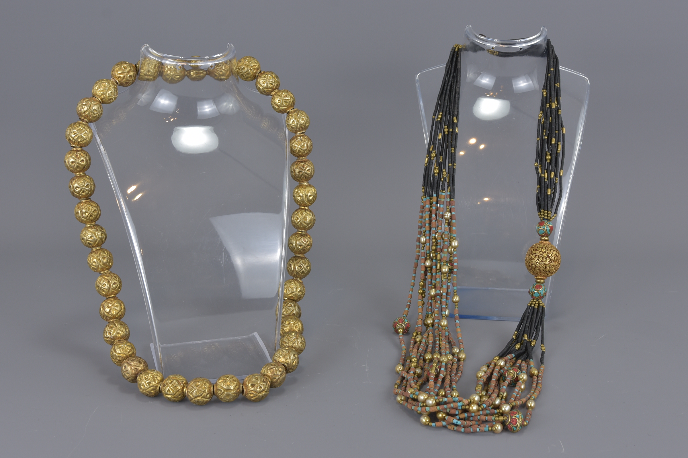 Two Asian gilt necklaces.