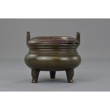 A Chinese 17th century bronze censer with a hard w