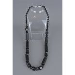 A 20th century Art Deco style black jet necklace.