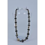 A banded Agate necklace with Gold Metal Spacers.