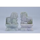 A Pair of Chinese green and lavender Jadeite Lion Dogs. 8.5cm tall