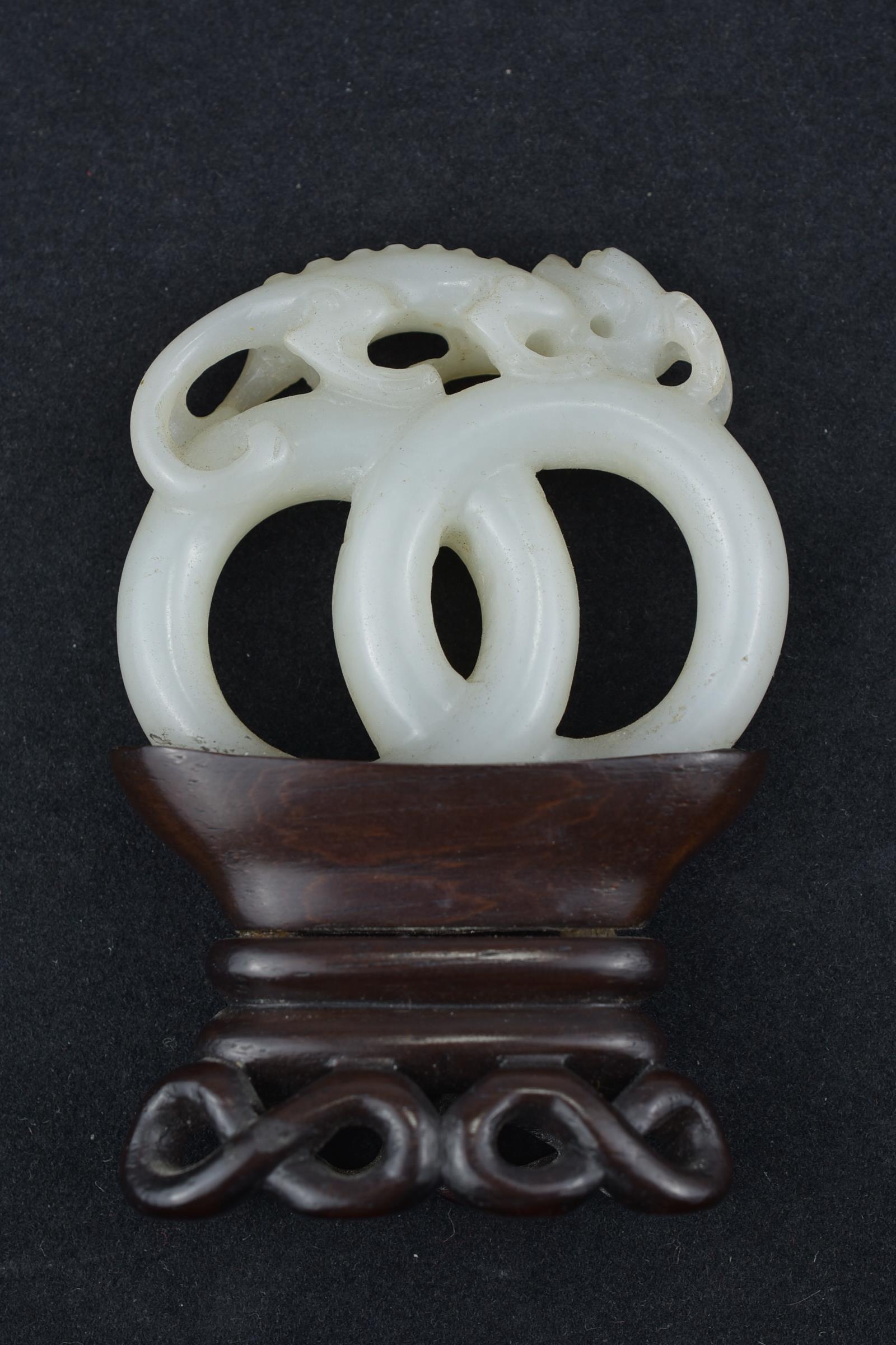 A 19th century Chinese carved White Jade joined rings surmounted by a dragon attached to wooden stan - Image 4 of 13