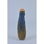 A Chinese Blue Stone Snuff Bottle with Orange Stopper. 12cm