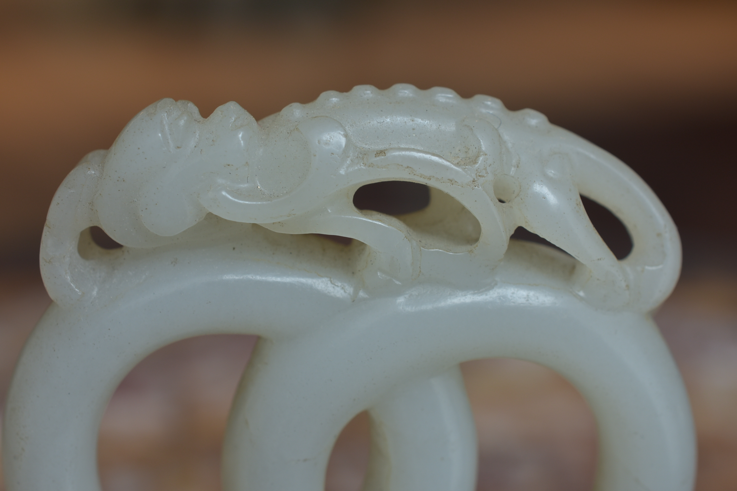 A 19th century Chinese carved White Jade joined rings surmounted by a dragon attached to wooden stan - Image 9 of 13