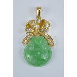 A Chinese carved jade pendant with 18K gold and diamond in ribbon design.