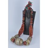 A large Ethnic Moroccan Beaded Necklace with coral beads, shells, amber resin and silver enamel bead