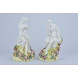 A Pair of John Bevington porcelain figurines of ladies sat amongst flowers circa 1890. 27cm tall (2)