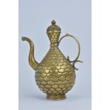 A Chinese bronze scale design ewer and cover with raised six character mark of Xuande to base. 21cm