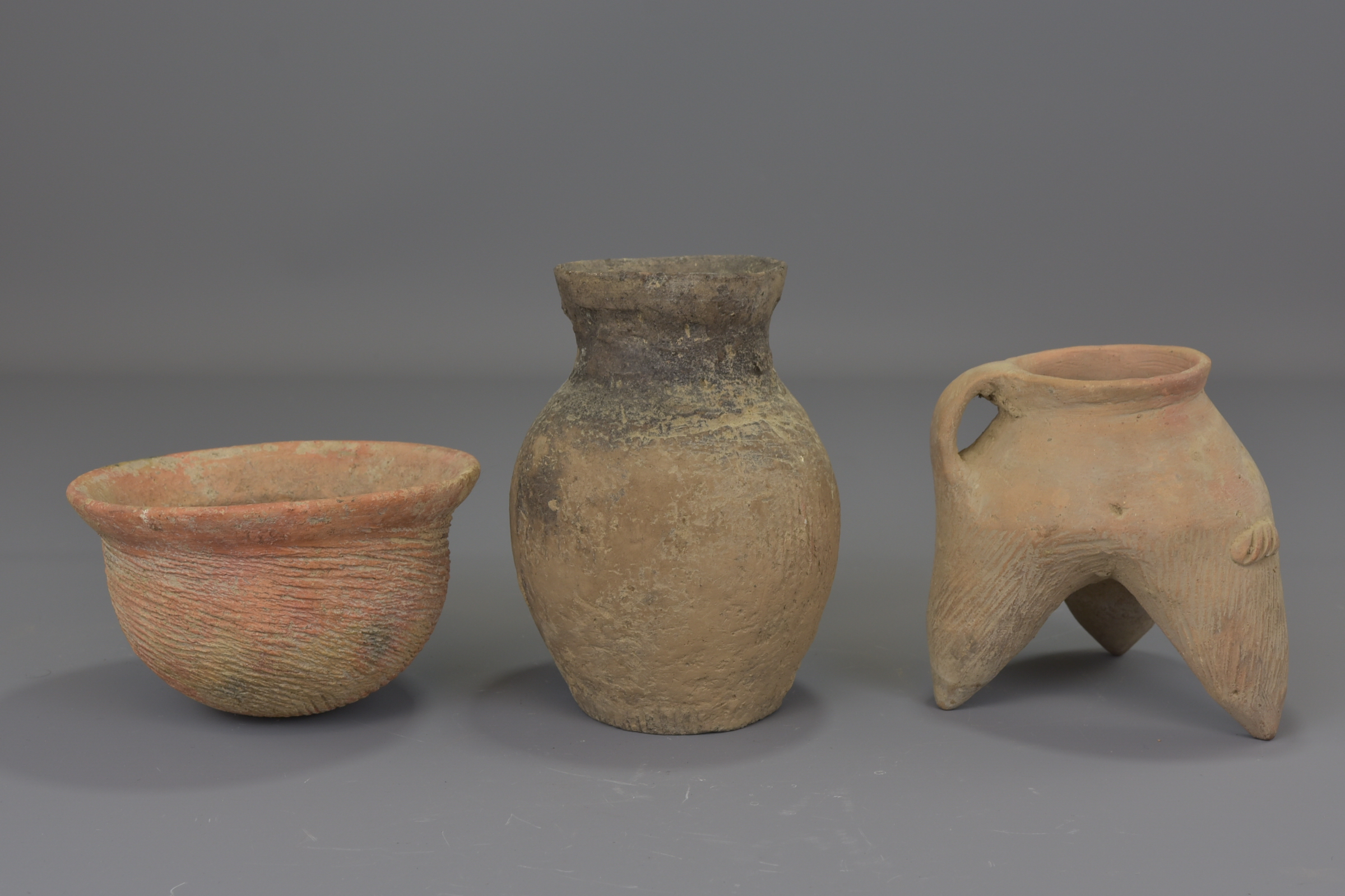 Three Chinese Neolithic period pottery pots and bowl. 12cm - 14cm tall. Provenance: From a private c