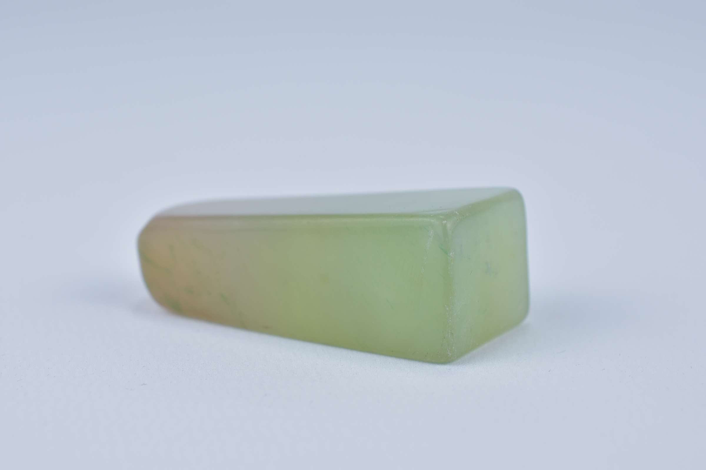 A Chinese pale green and yellow Jadeite Seal uncarved. 4.8cm x 2cm - Image 3 of 4