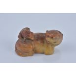 A 19th Century Chinese orange and yellow Soapstone Lion and cub. 7.5cm x 3.5cm