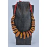 A large Moroccan Amber resin bead Necklace with silver inserts. 5cm largest bead