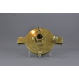 A Victorian polished- bronze measuring instrument. 23 cm diameter